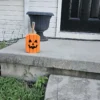 Small Orange Jack-O-Lantern made from 2x4 and a natural branch as stem.