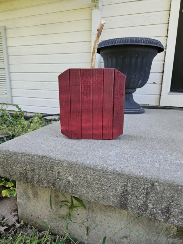 Large Wine RedJack-O-Lantern made from 2x4 and a natural branch as stem.